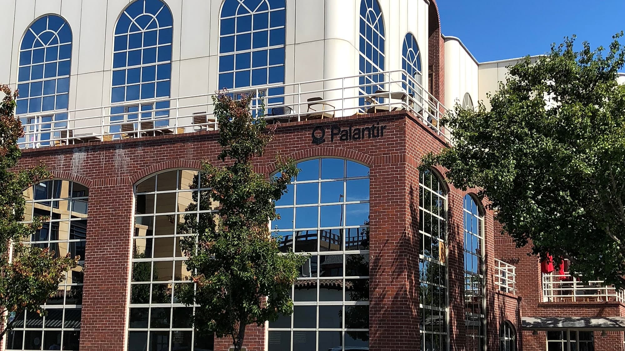 The Palantir sign on the brick facade of the company's Palo Alto offices in California