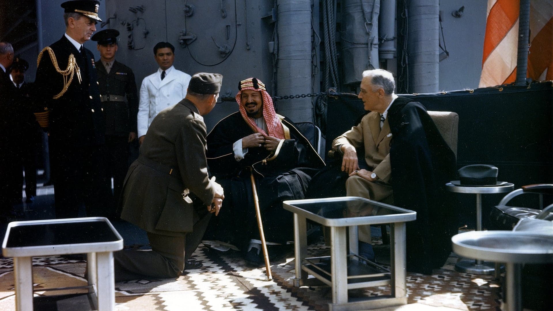 Roosevelt and King Ibn Saud seated on the deck of the cruiser USS Quincy in 1945