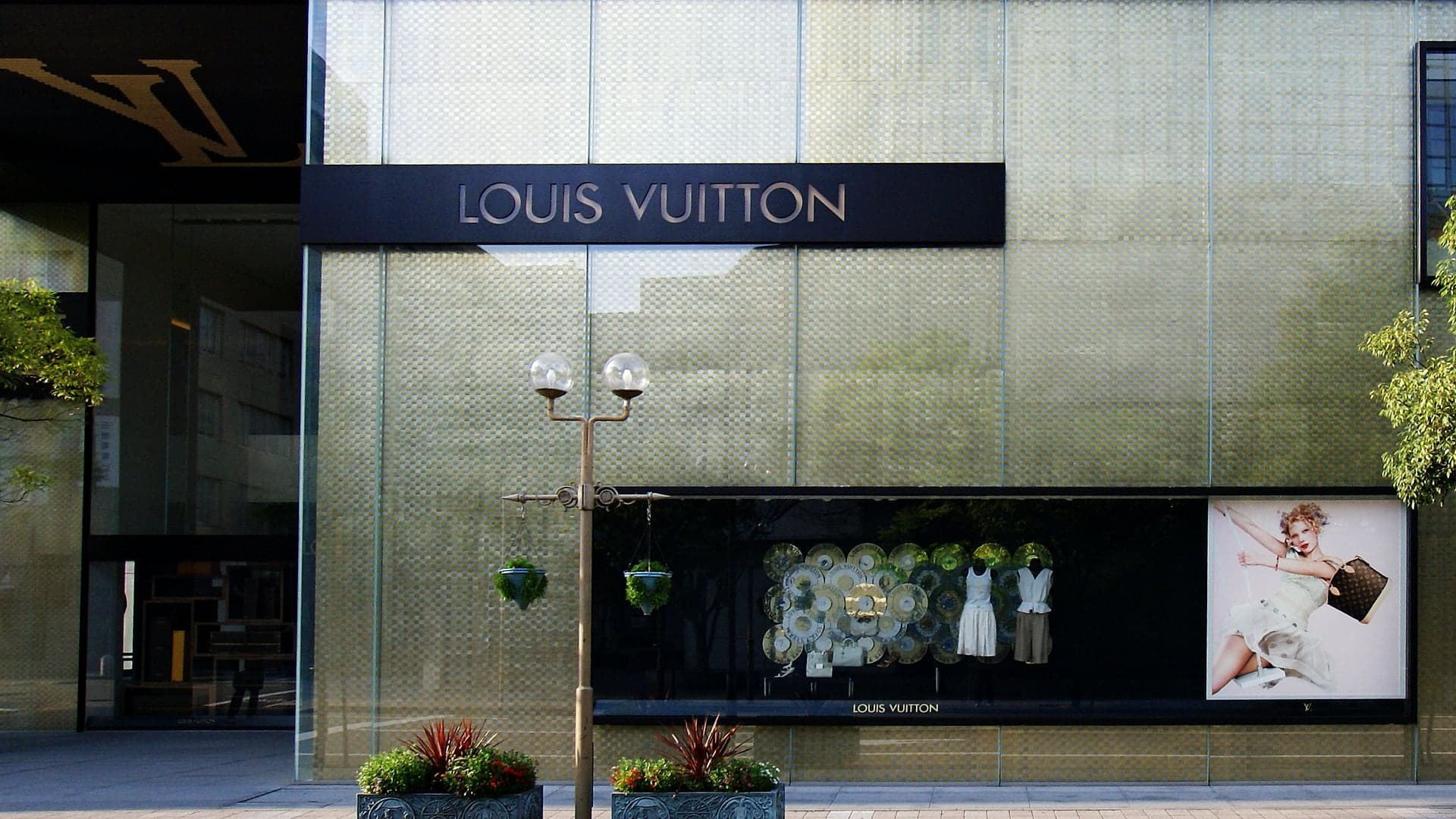 The Louis Vuitton sign on the golden facade of the LVMH building in Kobe, Japan